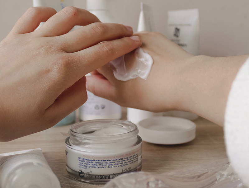 Person applying lotion to hand image